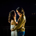 A couple on the rooftop at night
