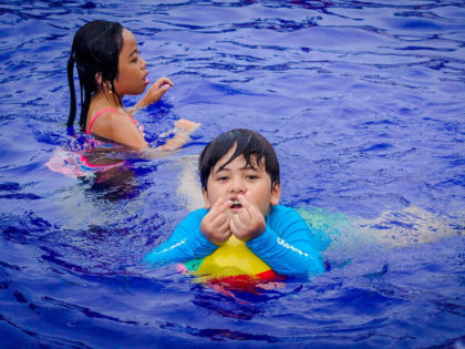 Kids swimming in the pool